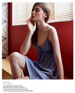 Detail of dark blue silk satin nightgown with elegant lace trim on the V-neckline