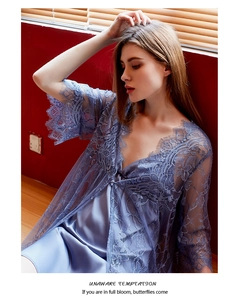 Detailed view of light blue lace robe and silk slip dress set with floral embroidery