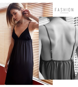 Detail of black satin sleepwear featuring delicate lace V-neckline and adjustable straps