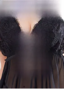 Detailed close-up of sheer mesh nightgown featuring delicate eyelash lace and floral embroidery
