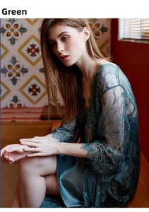 Close-up of green lace sleepwear set with silky satin lining and floral lace edges