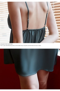 Detail of adjustable metal buckles and high-quality ice silk texture on green nightgown