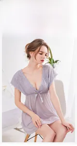 Detail of lavender lace nightgown featuring a deep V-neck and satin bow decoration