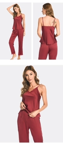 Detail of wine red silk pajama set featuring elegant V-neck lace trim and satin fabric