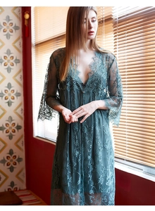 Detail of dark green lace robe with eyelash lace trim and sheer floral patterns