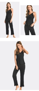 Detail of black satin pajama set with V-neck lace trim camisole and matching trousers