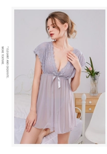 Close-up of lilac lace sleepwear featuring a deep V-neckline and satin bow detail