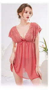 Detail of elegant lace trim and satin bow on a sheer rose pink babydoll nightgown