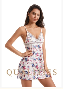 Detail of floral print nightdress featuring delicate white lace trim and V-neckline