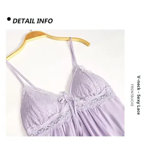 Detail view of the elegant V-neck lace design and bow ornament on a purple silk slip dress