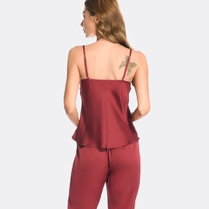 Women's silk satin burgundy pajama set with camisole top and long pants in rear view