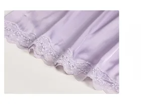 Close-up of the delicate purple lace embroidery on the satin hem of this sexy nightgown