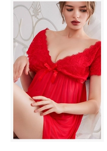 Close-up of red lace nightgown featuring a deep V-neck and silk bow knot detail