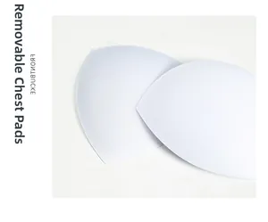Detail of white removable chest pads with smooth edges for silk lingerie dresses