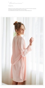 Detail of pink silk satin robe with elegant lace sleeve cuffs for women's sleepwear