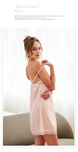 Pink silk slip dress featuring delicate lace trim and elegant spaghetti straps detail