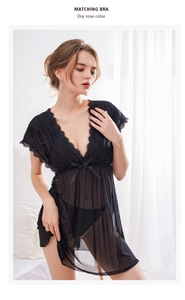 Detailed view of sheer black lace nightgown with deep V-neck and delicate bow accent