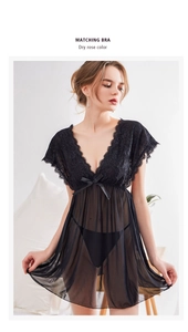 Detail of black lace teddy lingerie with deep V-neckline and satin bow embellishment