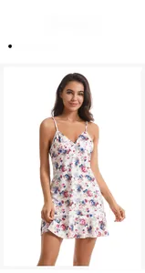 Close-up of white floral knit cotton sleepwear with blue flowers and ruffled hem details