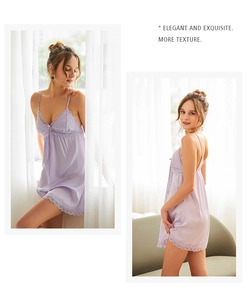 Detail view of purple satin slip dress with lace trim and elegant bow accent