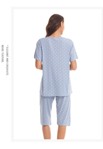 Detail of light blue checkered pajama set with orange polka dots from the back view