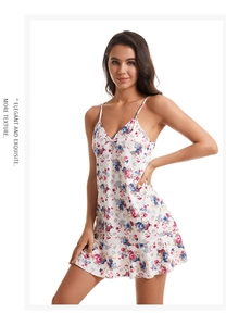 Detail of floral knit cotton nightdress featuring a V-neck and delicate ruffle hemline