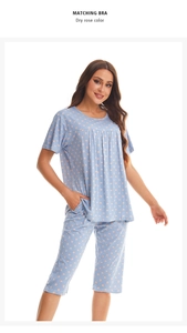 Detail of light blue plaid and pink polka dot fabric for two-piece women pajama set