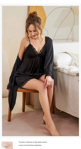 Detail of black silk pajama set showing exquisite eyelash lace trim on robe and chemise