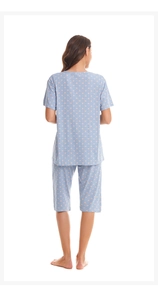 Back view of light blue polka dot summer pajama set with short sleeves and capri pants