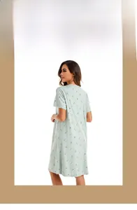 Detail of mint green floral cotton nightdress showing loose fit and short sleeve design