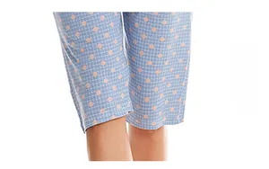 Detail showing high-quality hem edge on blue and white checkered pajama pants with pink dots