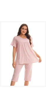 Detail view of pink short sleeve pajama set with blue dots for summer loungewear