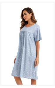 Close-up of light blue floral cotton nightgown with round neck and pleated details