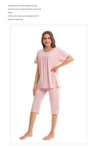 Close-up of pink polka dot cotton pajamas with smooth satin trim and soft texture