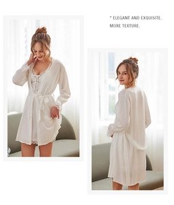 Detail of white satin robe set with elegant lace embroidery and silk texture