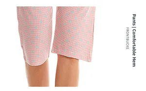 Detail of pink plaid pajama pants with blue dots showing the comfortable hem edge design