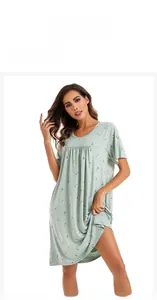 Detail of light green floral nightdress featuring soft cotton fabric and round neckline