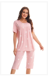 Close-up of pink checkered women's summer pajamas with heart and grape motifs