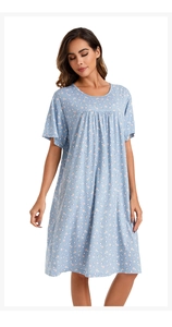 Close-up of light blue floral cotton nightgown with pleated neckline and soft texture