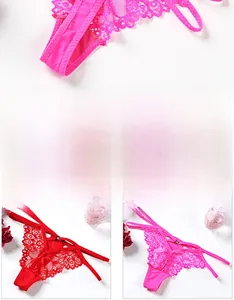 Detailed view of lace thong with strappy design and sparkling rhinestone accents