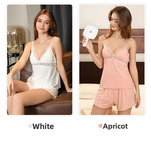 Detail of ribbed modal sleepwear set with lace V-neck camisole in white and apricot