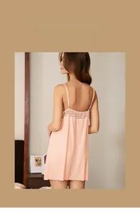 Detail of peach pink modal nightdress featuring elegant lace back and thin straps