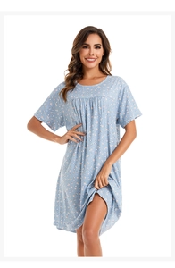 Detail of round neckline and soft pleats on light blue floral cotton nightgown