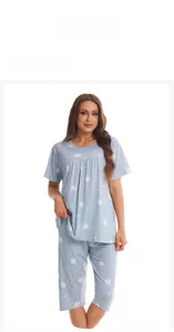 Detail view of light blue cotton short sleeve pajama set with white heart patterns