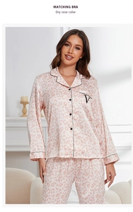 Detail of dry rose leopard silk pajamas with black piping and embroidered chest pocket