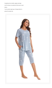 Close-up of women's blue cotton pajama set featuring white heart and polka dot prints
