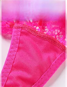 Macro shot of bright pink lace detailing and breathable mesh fabric with reinforced stitching