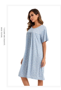 Detail of short sleeve floral nightdress featuring round neck and soft pleats in light blue