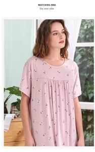 Detail of floral printed nightdress in dry rose color with pleated waist and soft fabric