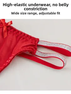 Detail of red lace thong featuring a satin bow and high-elastic silver glitter waistband